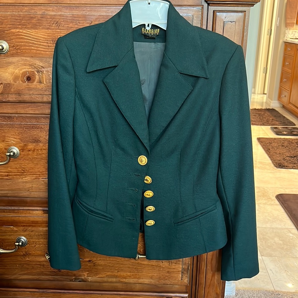 Beautiful hunter green suit with brass buttons in a size 2.